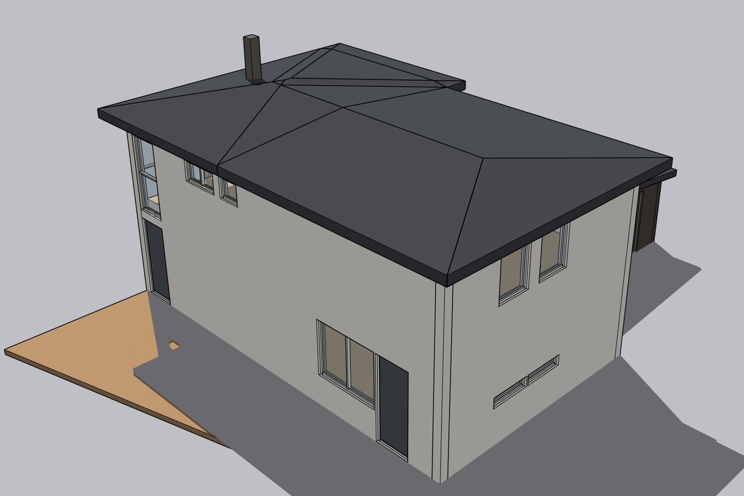 The house from the back, with the patio and hip roof